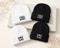 White and black beanie hats with dog mom and dog dad designs
