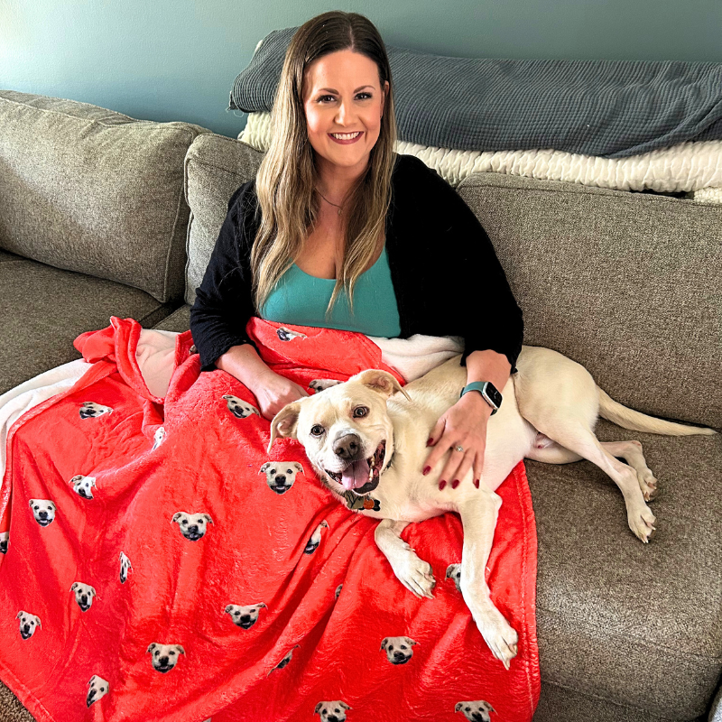 Personalized pet blanket with dog relaxing on the couch